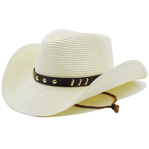 Detail of cream woven cowboy straw hat featuring a leather band with gold rivets and chin strap