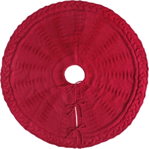 Red knit Christmas tree skirt with cable pattern and ties on white background
