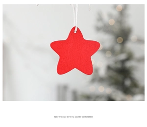 Detailed view of red wooden star ornament hanging against a festive blurred background