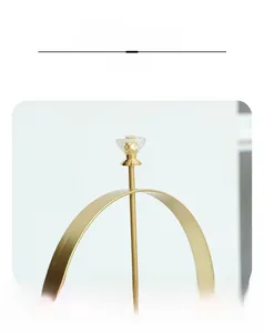 Detail of champagne gold iron napkin holder with crystal handle for easy lifting