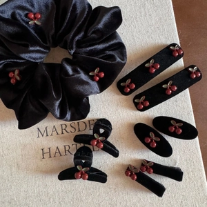 Retro black velvet cherry hair accessory set including scrunchie, clips, and claw clamps