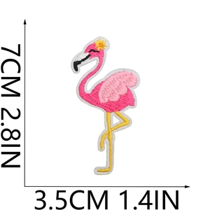 Pink flamingo embroidery patch detail with dimensions 7cm x 3.5cm on white background