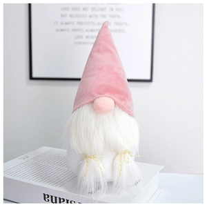 Pink plush faceless gnome with long white beard displayed on a book for home decor