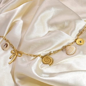 18K gold plated stainless steel necklace with shell, bow and evil eye charms on satin