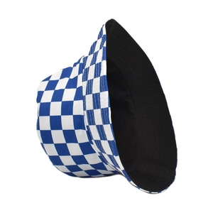 Detailed view of reversible checkered bucket hat in blue and white canvas