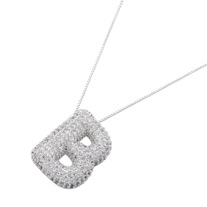 Detailed close-up of puffy letter B pendant encrusted with white cubic zirconia stones