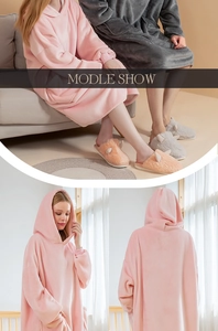 Detail of oversized hooded flannel blanket hoodie with ribbed cuffs and soft plush texture