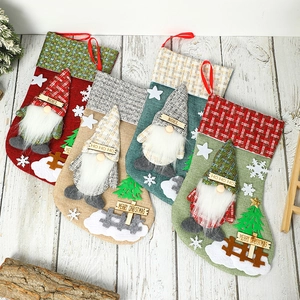 Set of 4 burlap Christmas stockings with 3D gnome dolls and holiday greetings