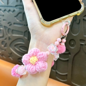 Cinturino per cellulare con fiori all'uncinetto rosa e pon pon in peluche soffici