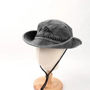 Detailed mountain peak embroidery on a dark grey cotton bucket hat with adjustable chin cord