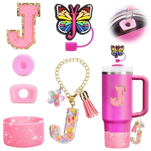 Pink Stanley cup accessory set with letter J charm, resin butterfly, and glitter boot