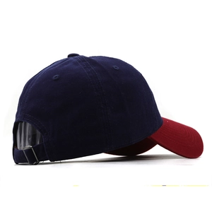 Detail of adjustable metal buckle and stitching on blue and red camouflage baseball cap