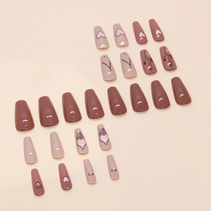 Long coffin press-on nails set in dusty rose with leaf patterns and pink hearts
