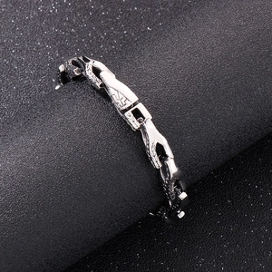 Detail of silver stainless steel bracelet featuring unique interlocking hands link design