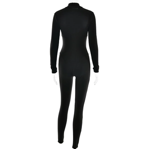 Rear view of sleek black long sleeve bodysuit showing athletic seams and slim fit design