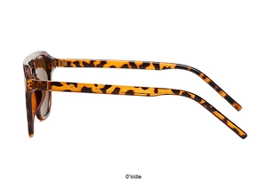 Detail view of tortoiseshell sunglasses frame with gold hinges and CE marking on the temple