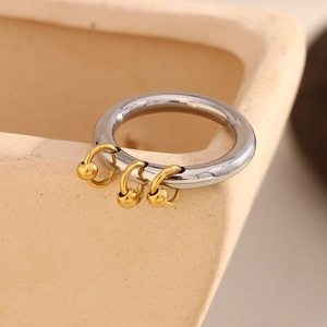 Macro view of 18K gold plated stainless steel bead ring with silver and gold accents