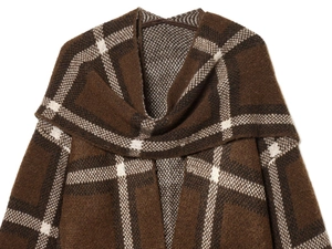 Close-up of brown plaid knitted cardigan showing warm wool texture and retro pattern