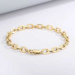 Polished gold rectangular link chain bracelet with lobster clasp on white background