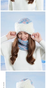 Detail of pink and blue knit winter hat with fluffy white faux fur lining and neck warmer