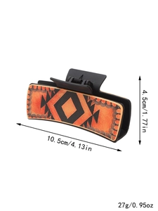 Pince à cheveux style Western avec motif géométrique orange et détails de taille