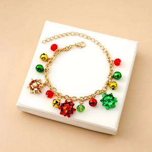 Detailed shot of Christmas charm bracelet with festive bells and colorful beads