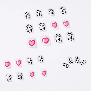Cow pattern press-on nails with pink hearts in square short style on white background