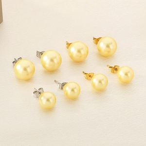 Set of four pairs of elegant yellow pearl earrings with gold and silver titanium steel bases