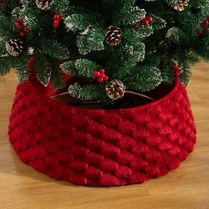 Red plush Christmas tree collar with 3D textured pattern for holiday decoration