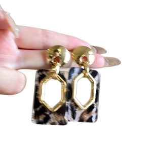 Leopard print geometric earrings with gold studs and rectangular acrylic resin pendants