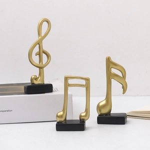 Set of three Nordic golden music note figurines on black bases for home desk decoration