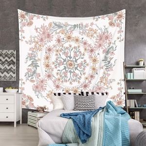 Close-up of mandala wall tapestry with floral pattern in pink and yellow hues