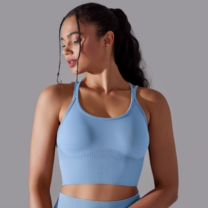 Close-up of light blue seamless sports bra featuring wide ribbed support band and straps