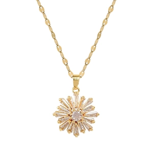 Elegant gold titanium steel necklace with sparkling starburst crystal pendant on white background