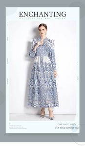 Detail view of vintage V-neck dress with blue paisley print and buttoned lantern sleeves