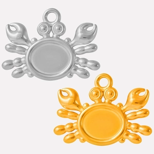 Detailed view of silver and gold crab pendants made of polished 304 stainless steel