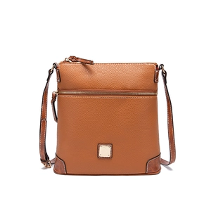 Macro detail of brown lychee grain leather crossbody bag with golden square hardware