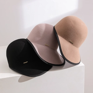Close-up of premium wool felt equestrian hats with neat binding and metal logo detail
