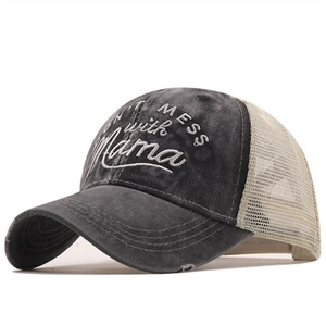 Detail of cross ponytail baseball cap with Don't Mess with Mama embroidery and mesh back