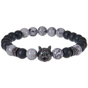 Detailed close-up of matte black beads and a wolf head charm with green zircon eyes