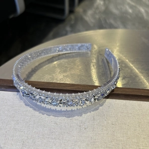 Detailed macro view of baroque silver headband with sparkling transparent crystal rhinestones