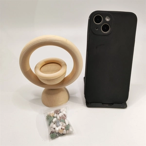 Vertical wooden essential oil diffuser with natural wood grain and decorative stones