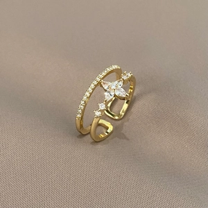 Macro shot of gold double-layer star ring with marquise zircons and pavé diamonds