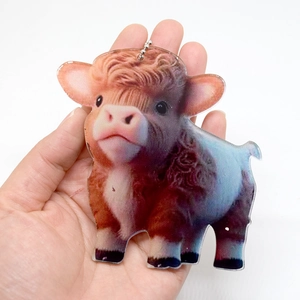 Detail view of Highland Cow acrylic pendant with realistic brown fur texture and chain