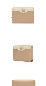 Detail view of two-tone cream and khaki mini wallet with snap button and side zipper