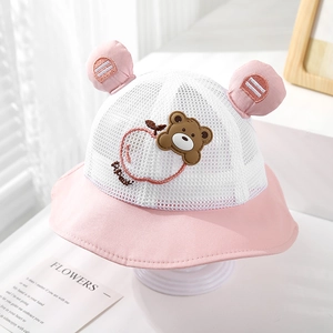 Close-up of baby sun hat with mesh vents, pink bear ears, and cute apple embroidery