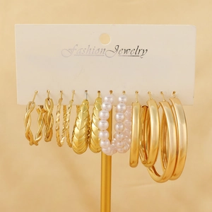 Elegant 6-pair gold hoop earring set with pearls and twisted textures on display card