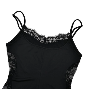 Close-up of black lace patchwork detail and delicate straps on a V-neck bodysuit