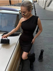 Close-up of black one-shoulder bodycon dress with sleek fabric and modern draping