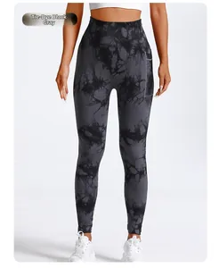 Detail of high waisted tie-dye yoga pants in charcoal grey with side pockets